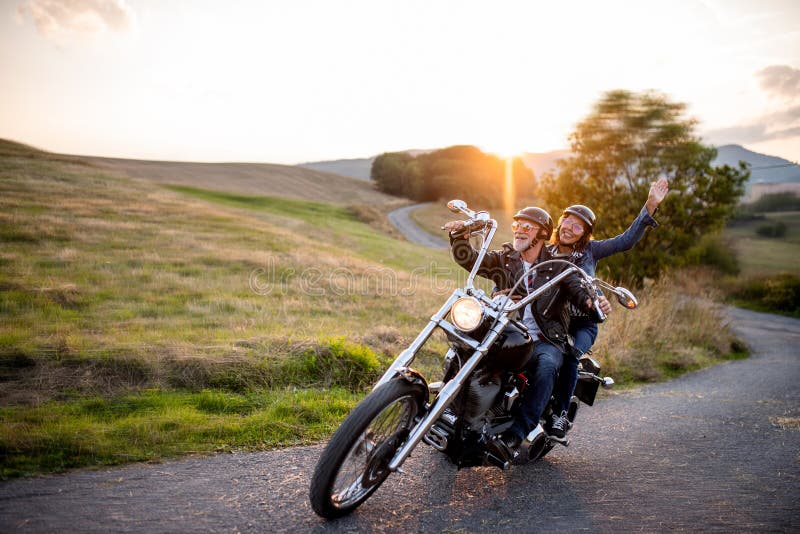 cheerful-senior-couple-travellers-motorbike-countryside-cheerful-senior-couple-travellers-motorbike-countryside-169190074.jpg
