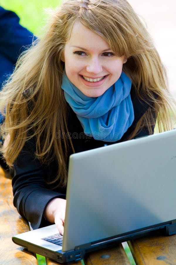 Cheerful smiling girl with laptop