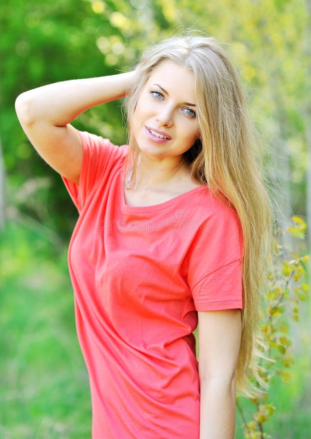 Cheerful smiling young beautiful blond woman
