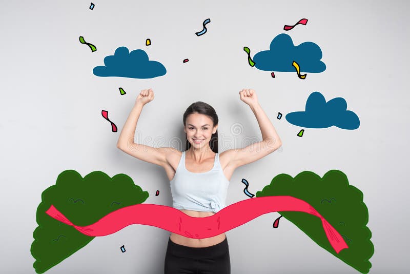 Cheerful sportswoman smiling while winning the marathon royalty free stock image Cheerful sportswoman smiling while winning the marathon royalty free stock image
