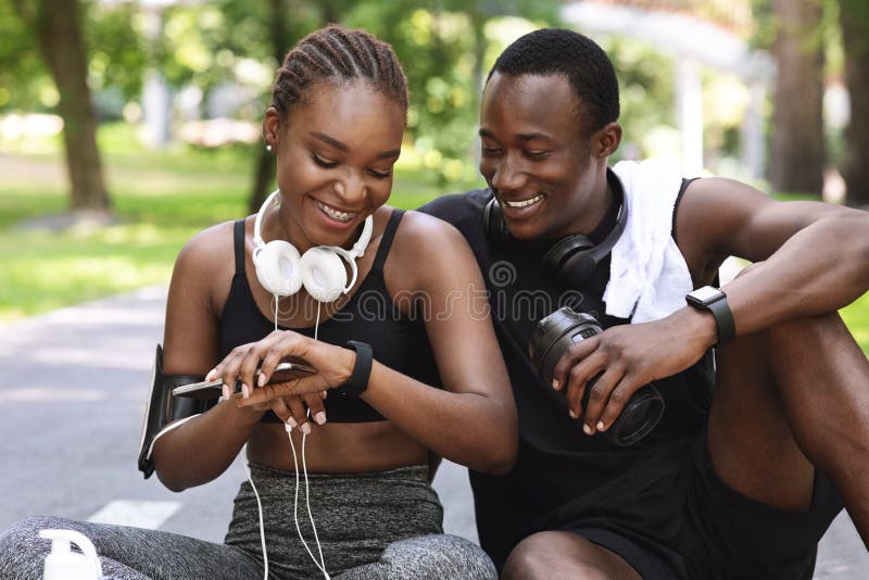 Smiling Young Couple Training Outside Together · Free Stock Photo