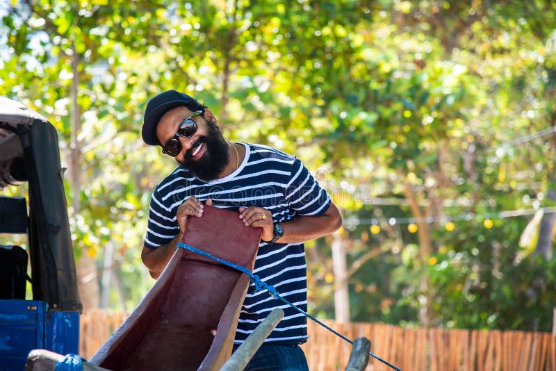 Cheerful Sri Lankan man on the beach royalty free stock image Cheerful Sri Lankan man on the beach royalty free stock image