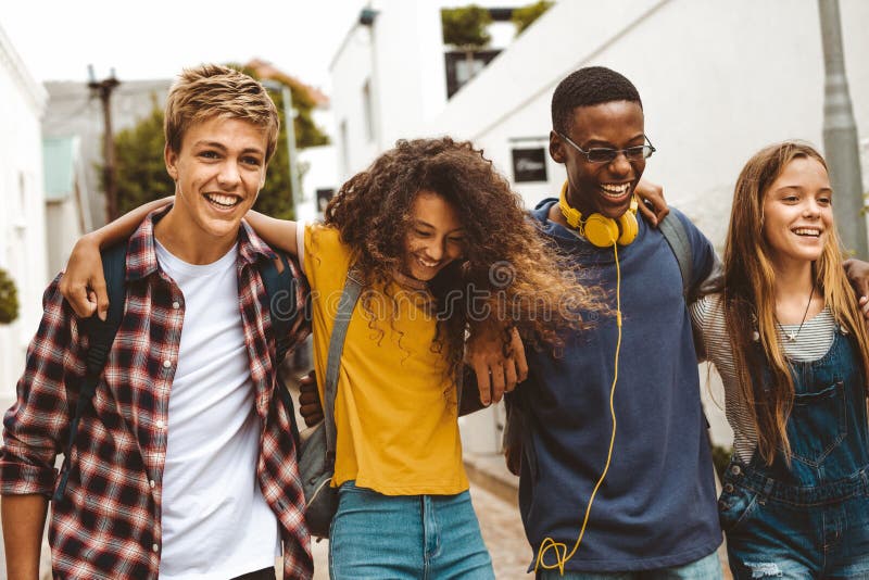 Cheerful teenage friends enjoying outdoors stock photo Cheerful teenage friends enjoying outdoors stock photo
