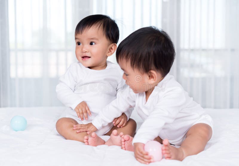 Cheerful Twin Babies Playing Color Ball on Bed Stock Photo Image of