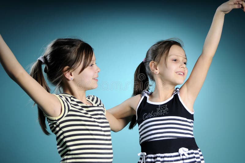 Cheerful white twins dancing