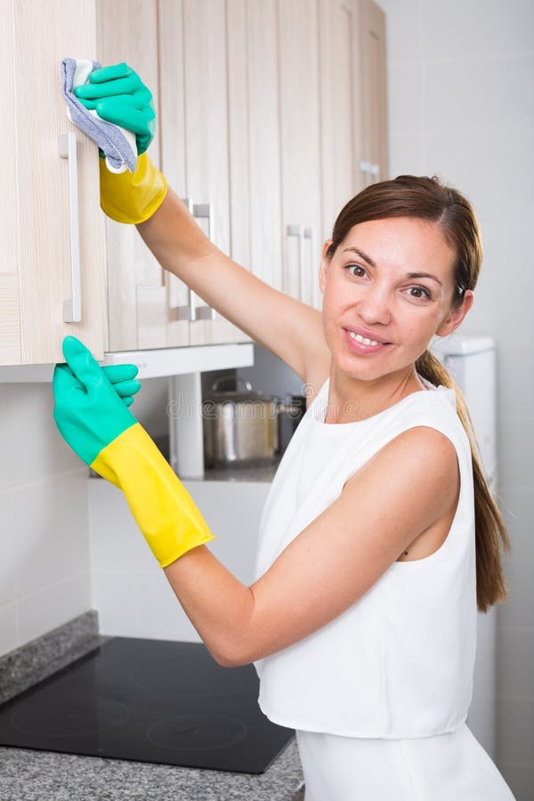 Cheerful Woman Cleaning at Home Stock Image - Image of detergent, apron ...