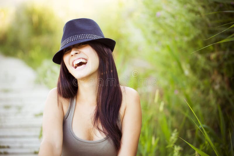 Cheerful woman with hat