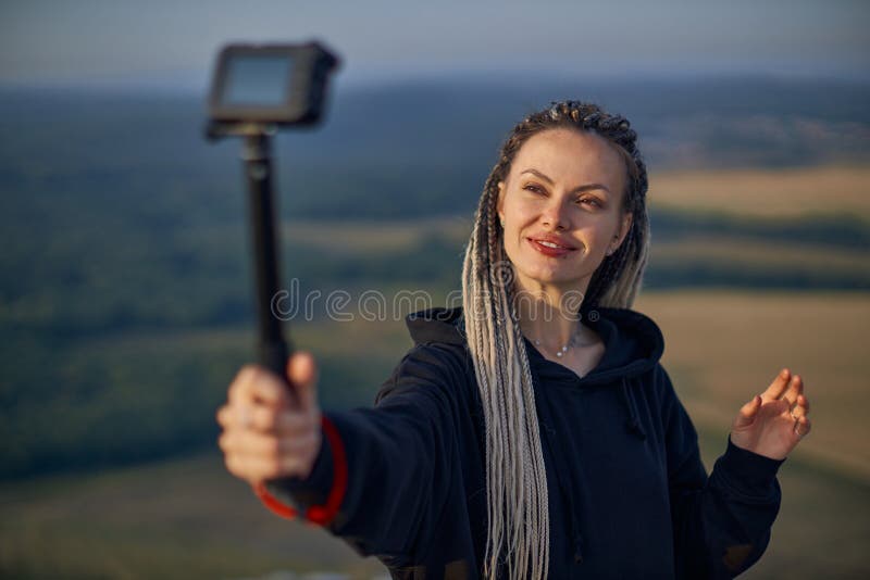 Cheerful Young Girl Blogger Takes A Selfie Takes Pictures Of Herself