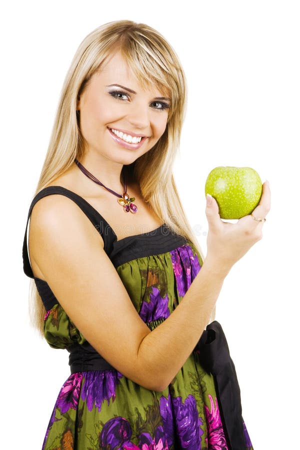 Cheerful young woman holding a fresh freen apple