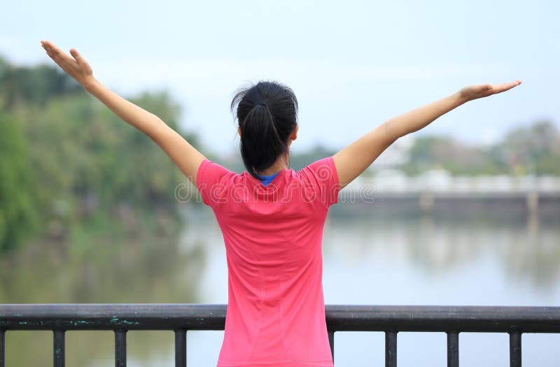 Cheering woman open arms at city royalty free stock photo Cheering woman open arms at city royalty free stock photo