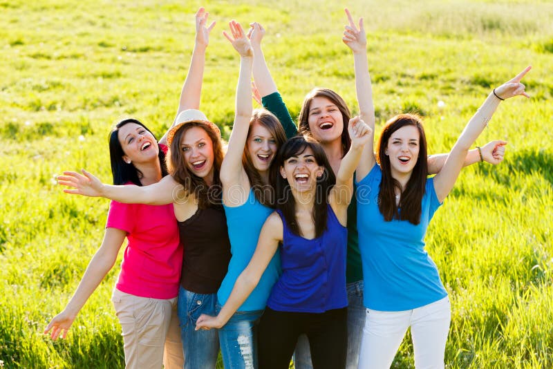 Lot of happy women cheering together outdoors. Lot of happy women cheering together outdoors.