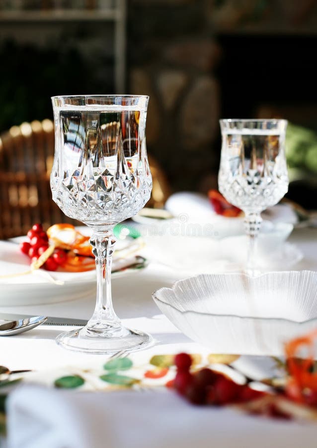 Photo of table set with sparkling wine glasses. Photo of table set with sparkling wine glasses.