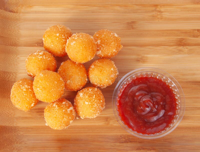 Cheese Ball Bonanza Powdery orange salty snack goodness. Yummy snack. Junk  food. Treat. Delicious background. Throwback food. Stock Photo