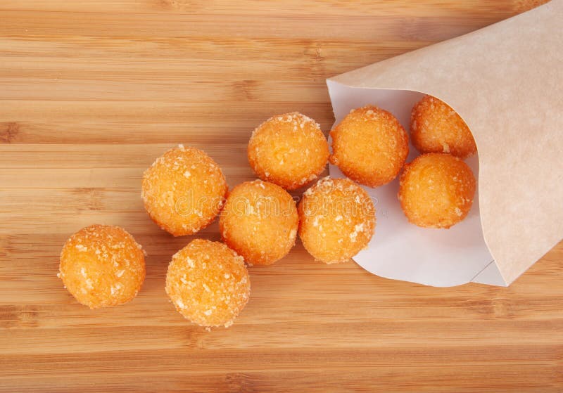 Cheese Ball Bonanza Powdery orange salty snack goodness. Yummy snack. Junk  food. Treat. Delicious background. Throwback food. Stock Photo