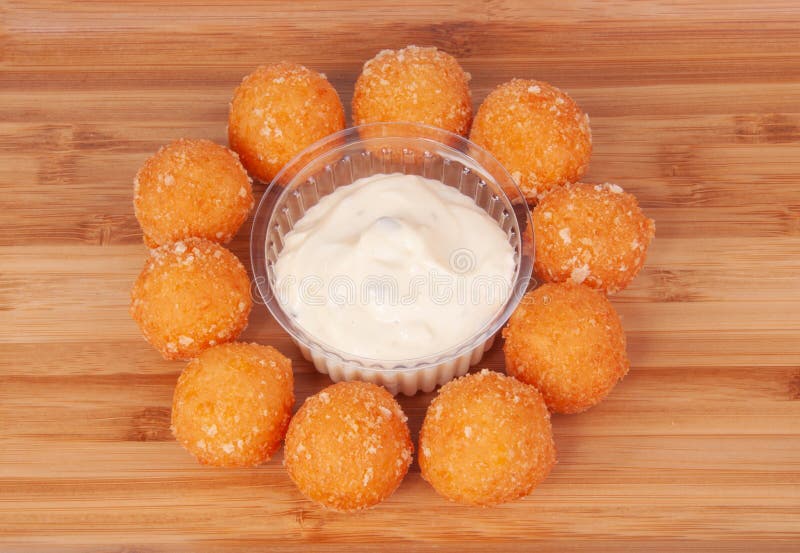 Cheese Ball Bonanza Powdery orange salty snack goodness. Yummy snack. Junk  food. Treat. Delicious background. Throwback food. Stock Photo