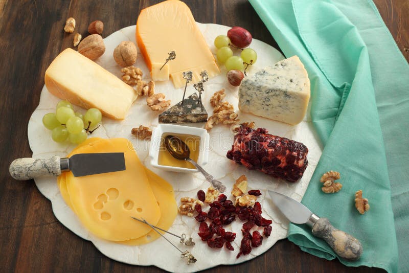 Various Types of Cheese on Abstract Vintage Paint Palette Stock Photo