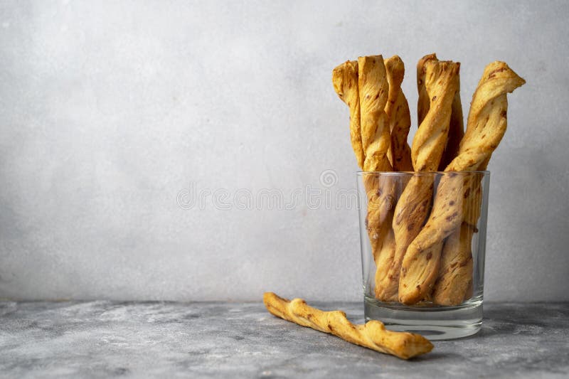 Cheese Breadsticks with Cheese in Glass, Snack Food. Copy Space Stock