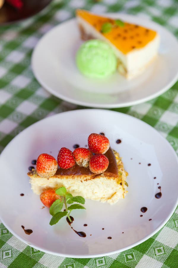 Cheese Cake and Icecream on Plate with Fruit Topping. Stock Image