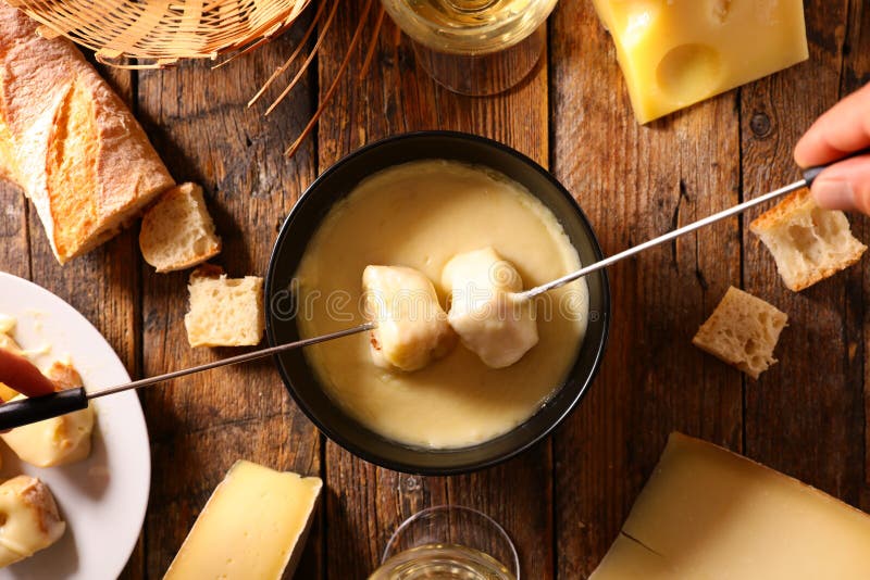 Cheese fondue with wine stock image. Image of eating 198404147