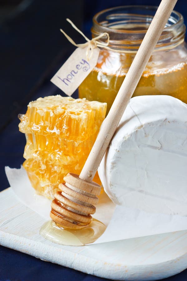 Cheese and honey. stock image. Image of spoon, dipper 25627149