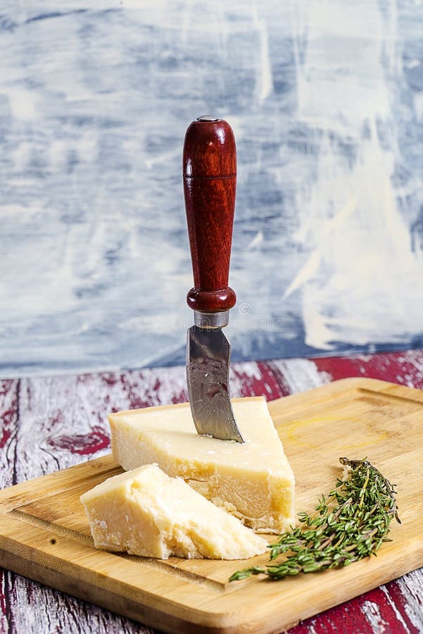 Cheese with cheese knife stock image. Image of block 134730919