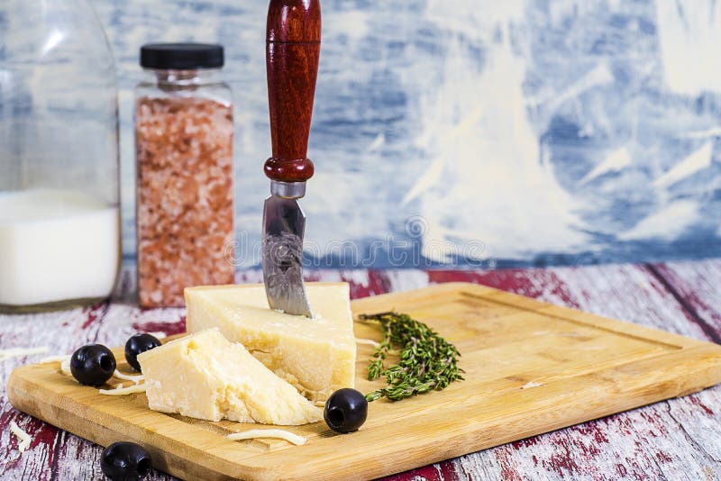 Cheese with cheese knife stock photo. Image of healthy 135419092