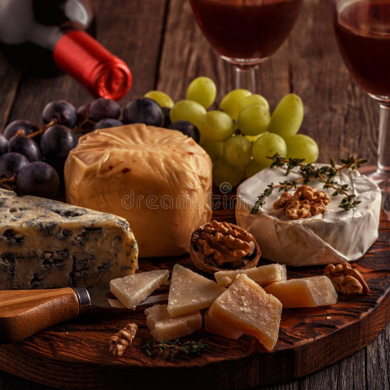 Cheese, Nuts, Grapes and Red Wine on Wooden Background. Stock Image Image of snack, drink