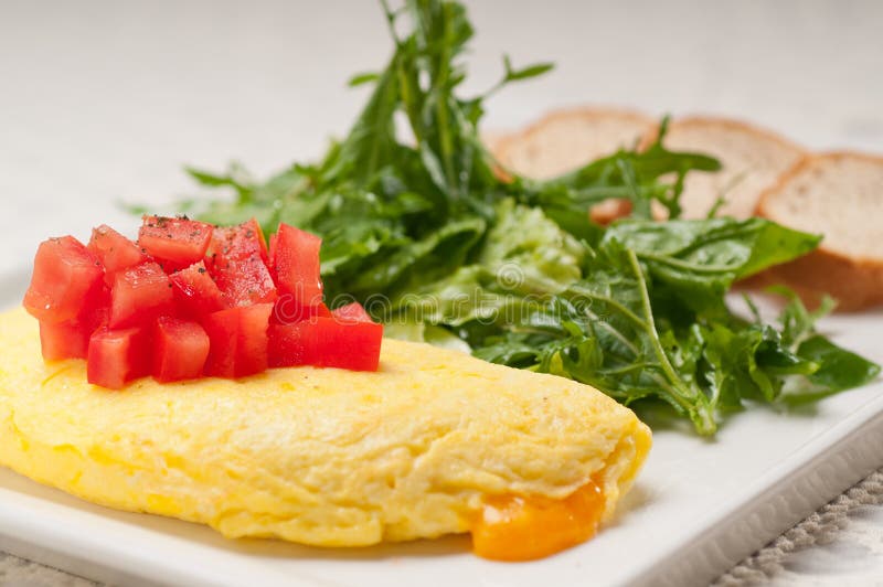 Cheese ometette with tomato and salad