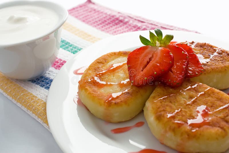 Cheese pancakes with strawberry royalty free stock image