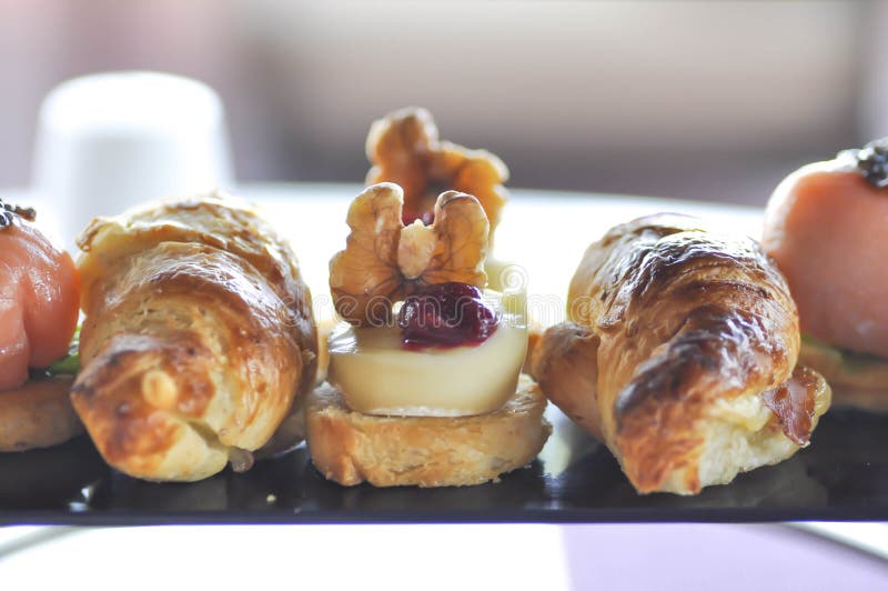 Cheese pie and croissant or canape royalty free stock photo