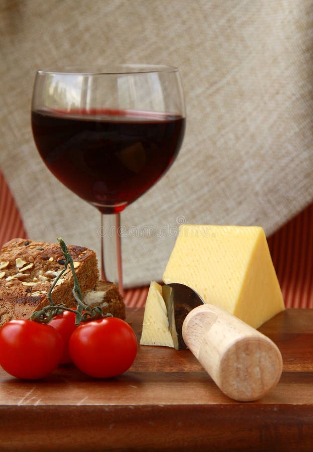 Cheese plate with cherry tomatoes, bread