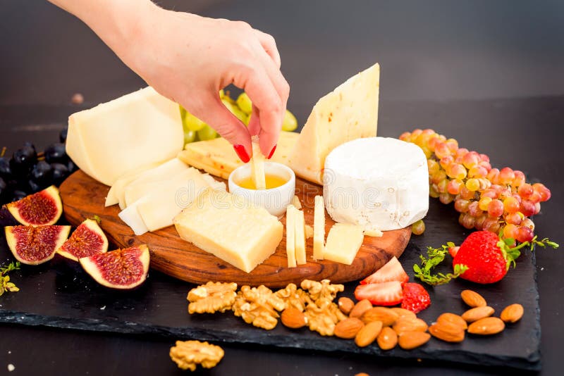 Cheese Plate Served with Grapes, Jam, Figs Stock Photo Image of