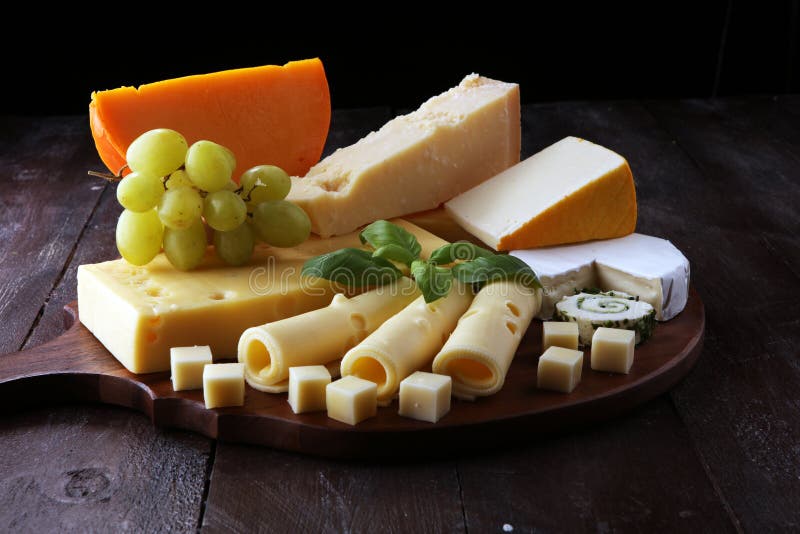 Cheese Plate Served with Grapes, Various Cheese on a Platter Stock