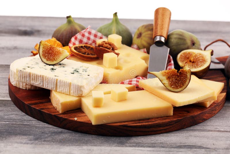 Cheese Platter with Different Cheese and Grapes and Figs and Nuts Stock