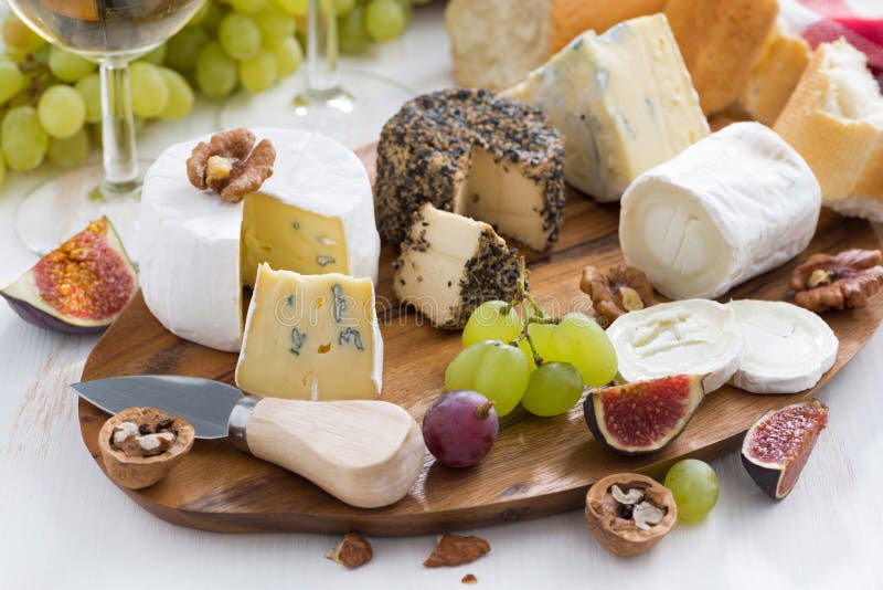 Cheese platter, snacks and wine, close-up