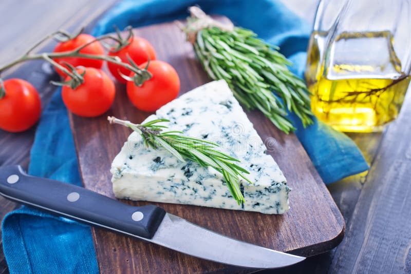 Various Types of Cheese on Abstract Vintage Paint Palette Stock Photo