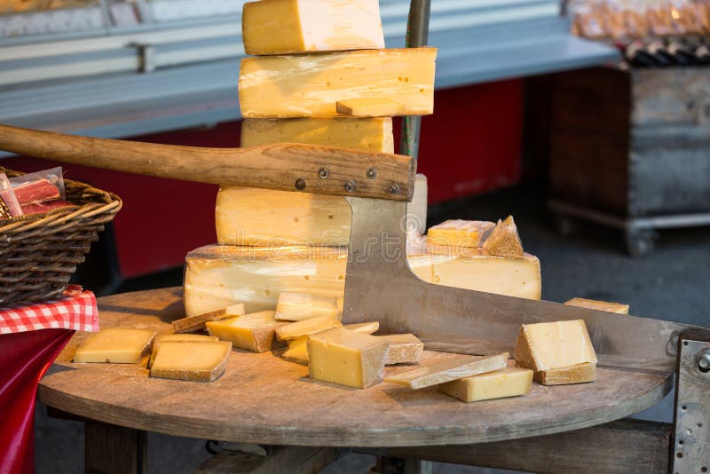 Cheese for Sale and an Old Cutter or Chopper Used for Slicing Cheeses in a  Market at Salzburg Stock Image - Image of court, industry: 88882183