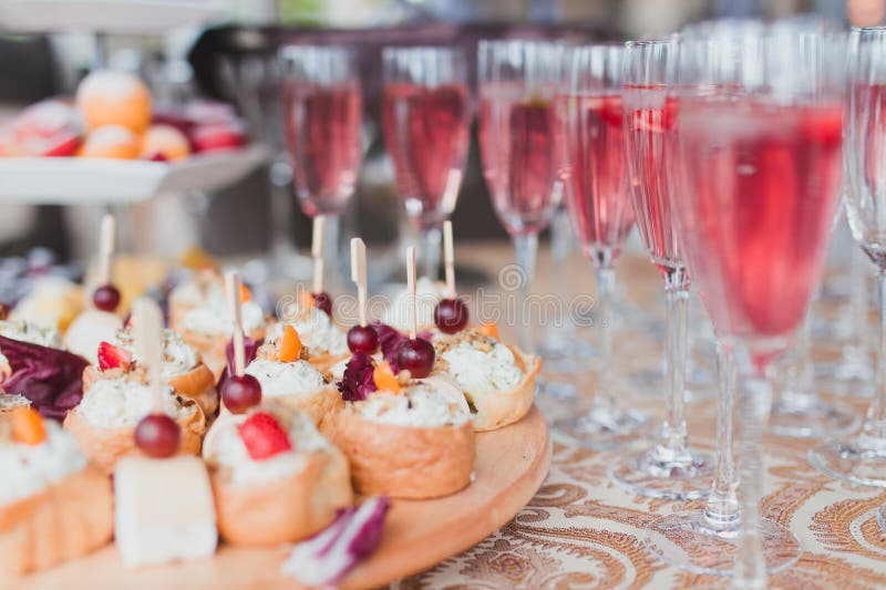 Cheese topped bread bun and wine