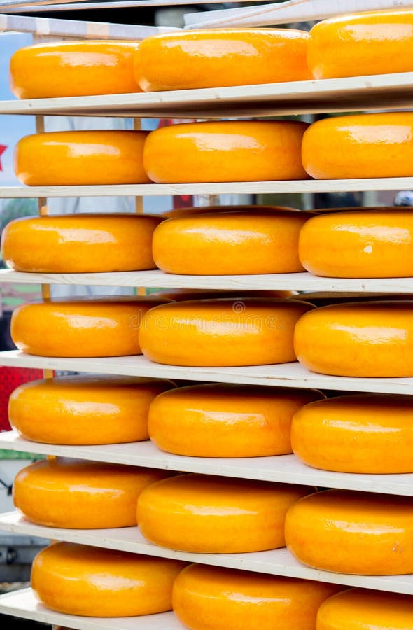 Cheese Wheel on shelves stock image. Image of wheel, farmer 54009105