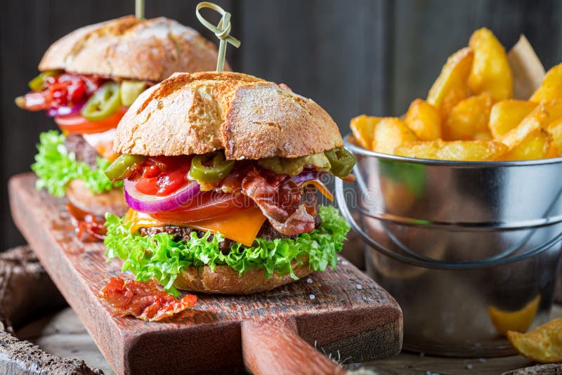 Cheeseburger Made of Beef and Vegetables with Chips. American Cuisine