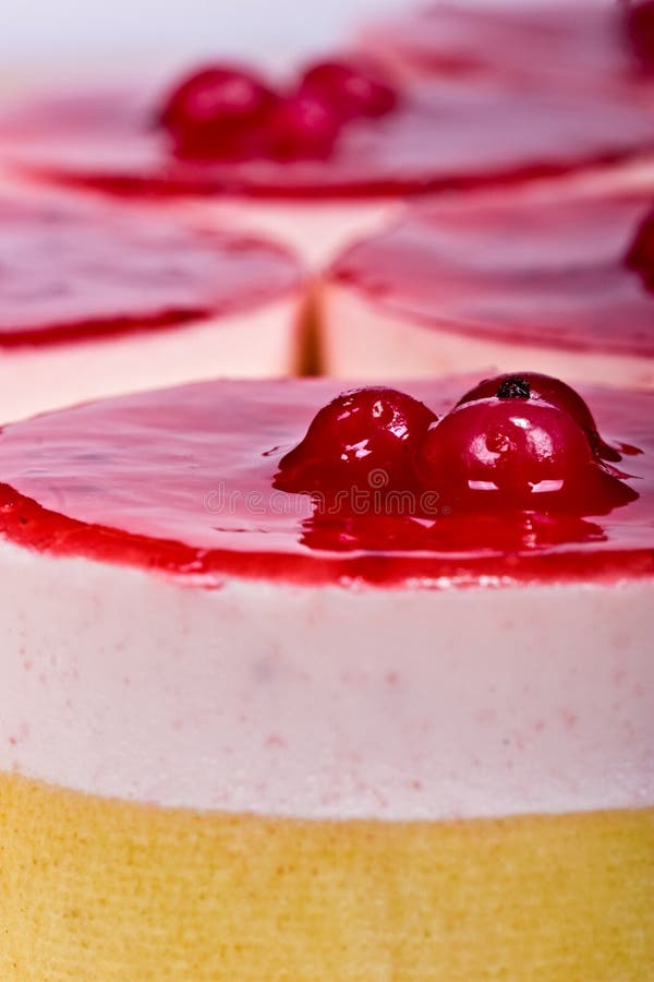 Strawberry cheesecake with glassed cherries; food series; in IPTC status, instructions, you will find the recipe. Dessert portions stock images, royalty-free photos and pictures