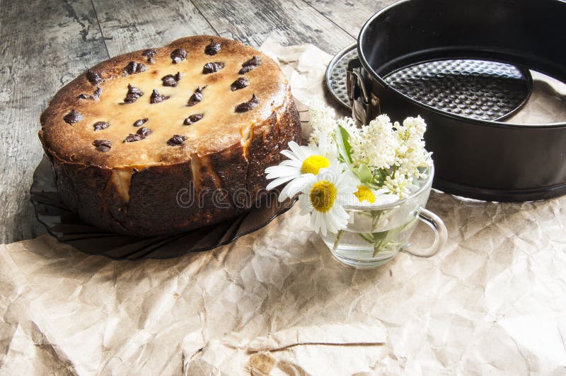 Cheesecake with a bouquet of daisies. Horizontal