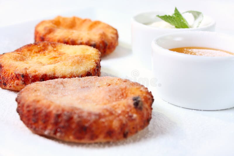 Cheesecakes with honey and sour cream royalty free stock photo