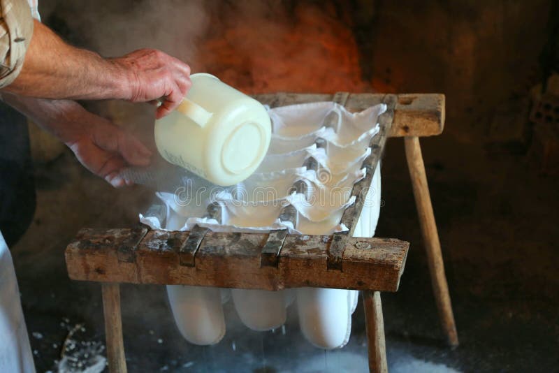 cheesemaker during the preparation of the cheese in the cheese f