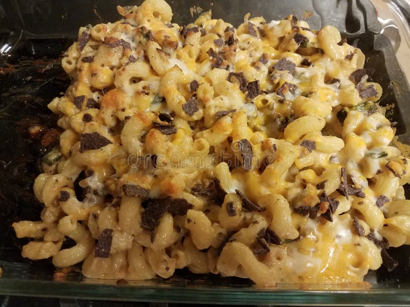 Cheesy Pasta with Cheese and Potato Chips in Glass Container Stock