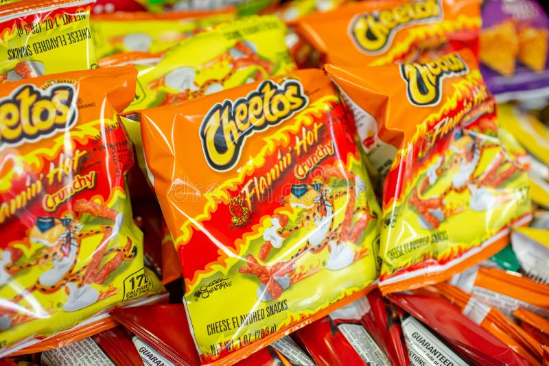 Cheetos on display. A view of several small bags of Cheetos Flamin` Hot Crunchy on display at a local convenient store stock photography Cheetos on display. A view of several small bags of Cheetos Flamin` Hot Crunchy on display at a local convenient store stock photography