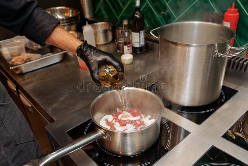Chef is Adding White Wine To a Dish Stock Photo Image of safety