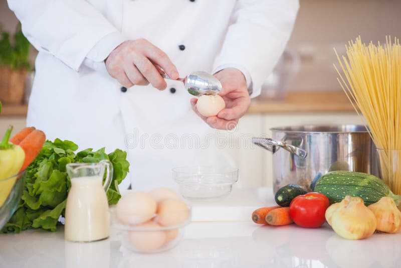 Chef Breaking an Egg stock image