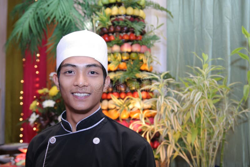 Chef in buffet smiling