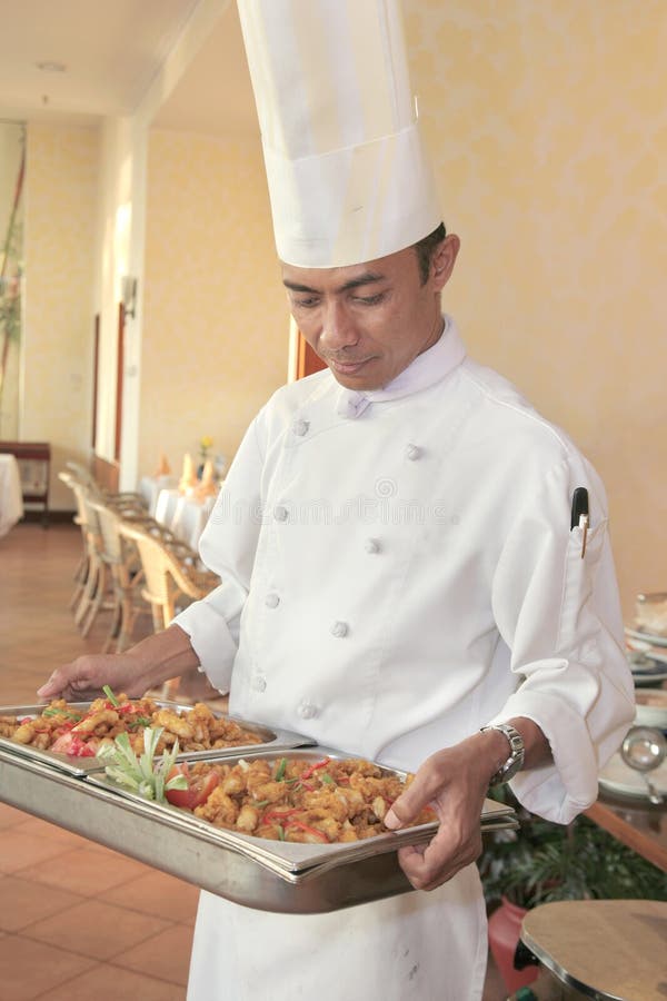 Chef carrying food for buffet